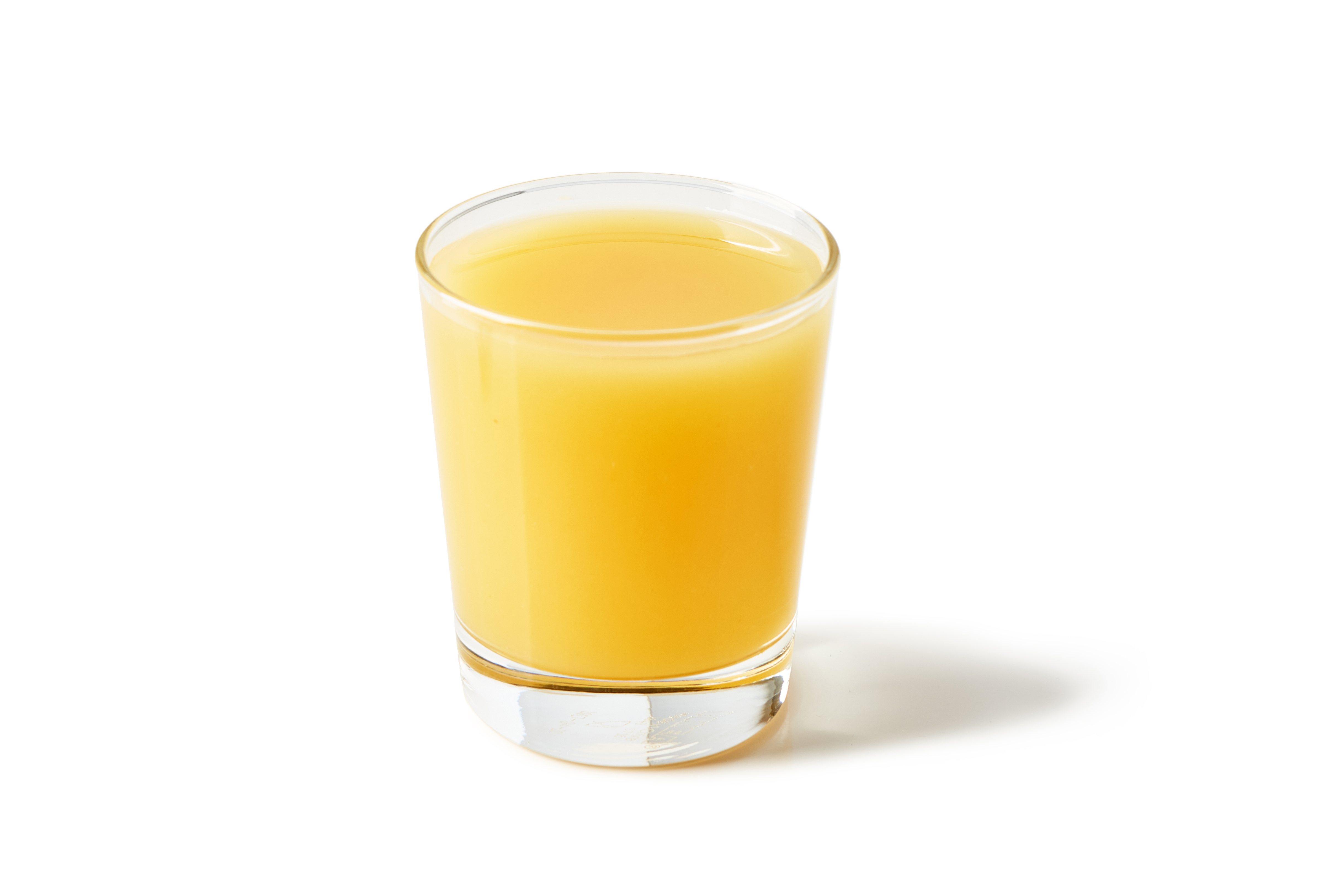 6 ounces of Del Monte Pineapple Juice in a clear glass